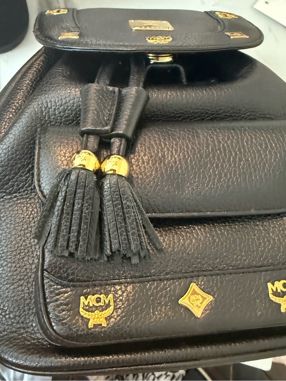 MCM Black Leather Drawstring Backpack with Gold Hardware